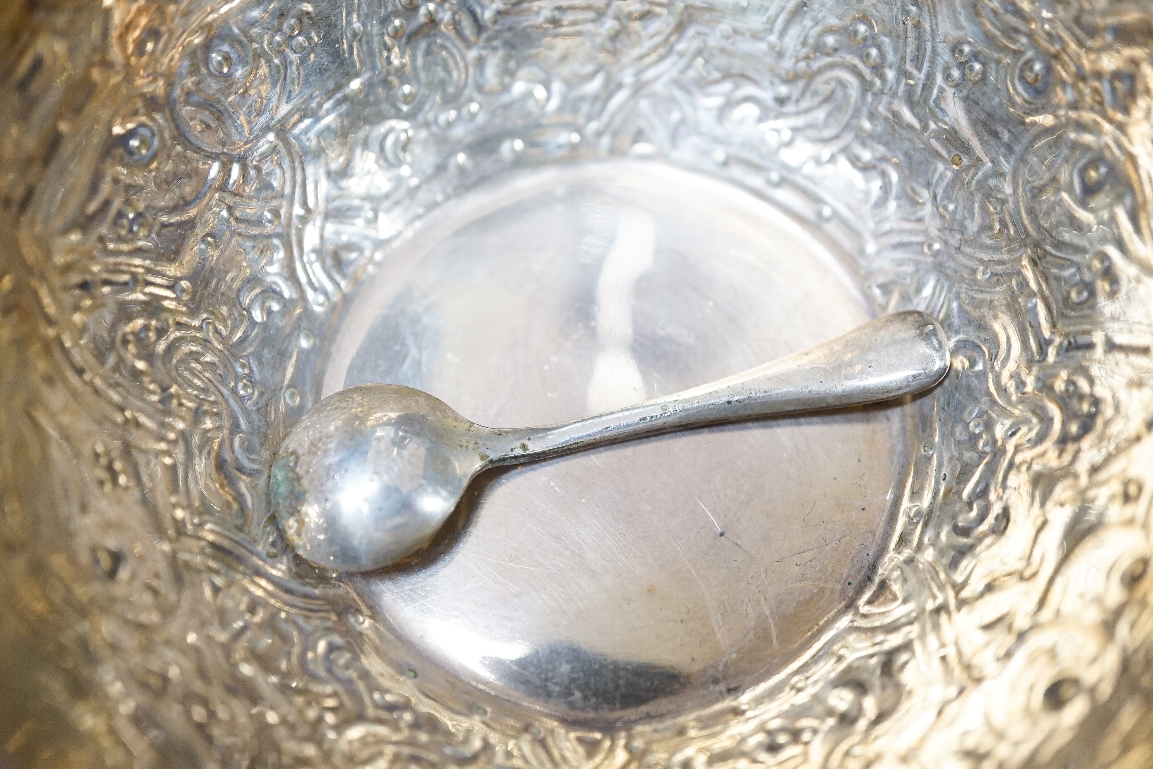A George V silver sugar caster, 18cm, a silver globular pot with hinged cover, 9oz, a silver plated cream jug, sugar bowl, salt and spoon.